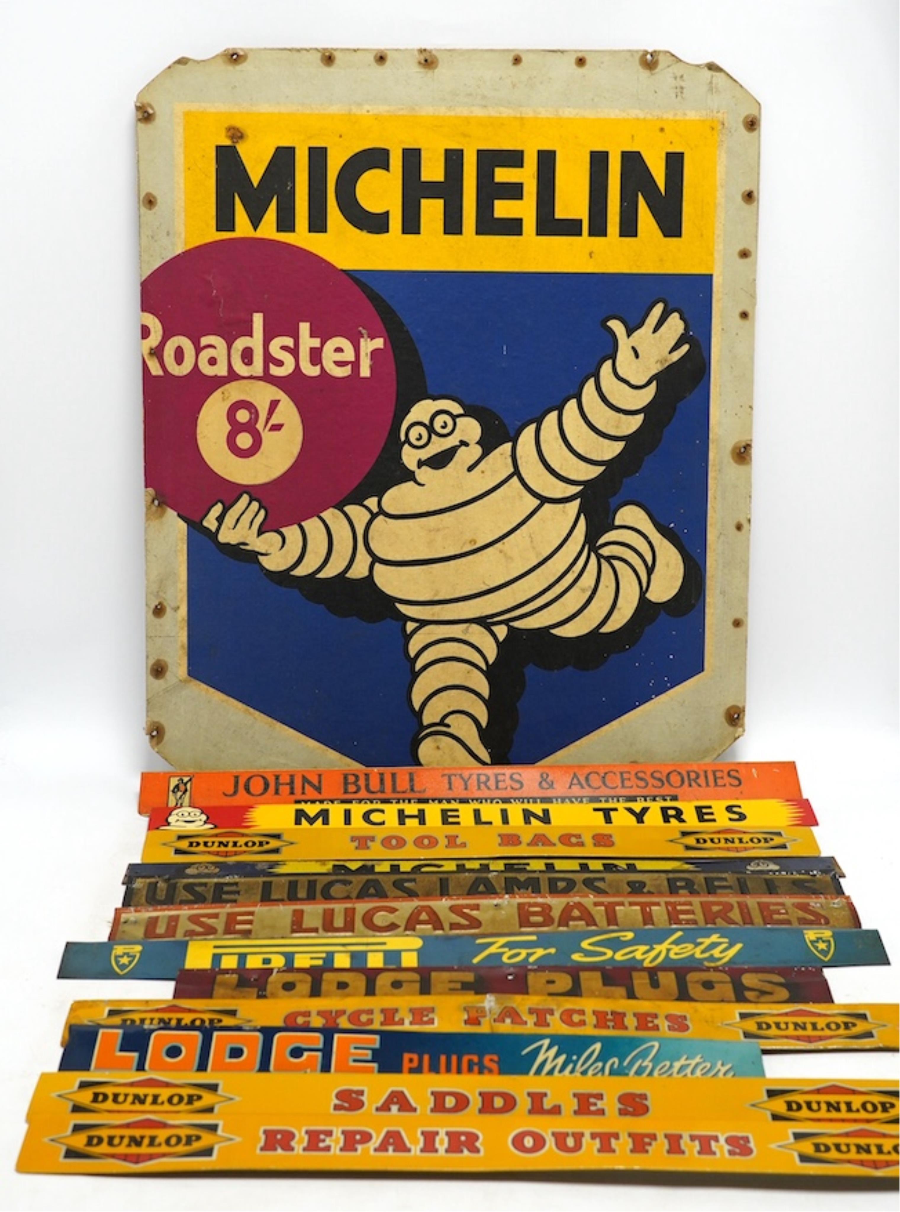 Motoring interest: twelve mid century tinplate advertising shelf strips, largest 48cm, together with a Michelin printed card advertising sign. Condition - poor, fair and good